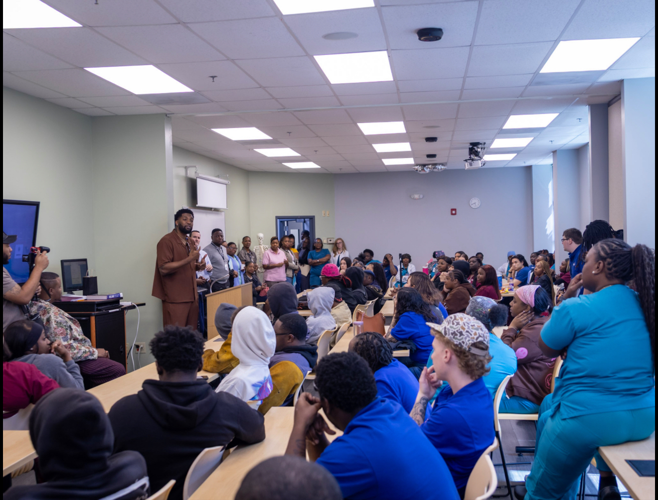Dr. Joshua Randall teaching in a classroom setting